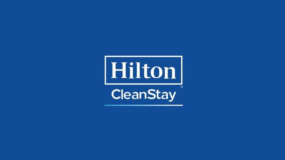 Aleph Doha Residences, Curio Collection By Hilton מראה חיצוני תמונה Hilton CleanStay logo