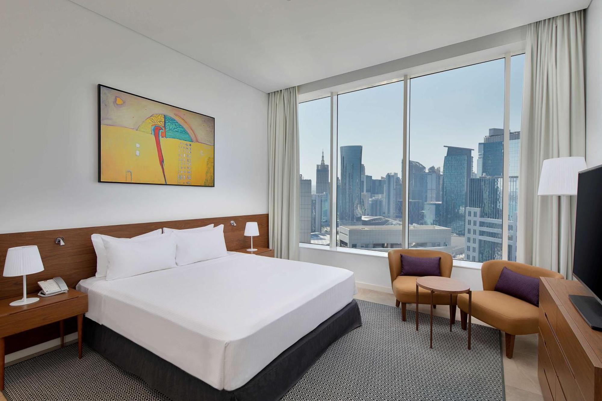 Aleph Doha Residences, Curio Collection By Hilton מראה חיצוני תמונה A bedroom at the hotel