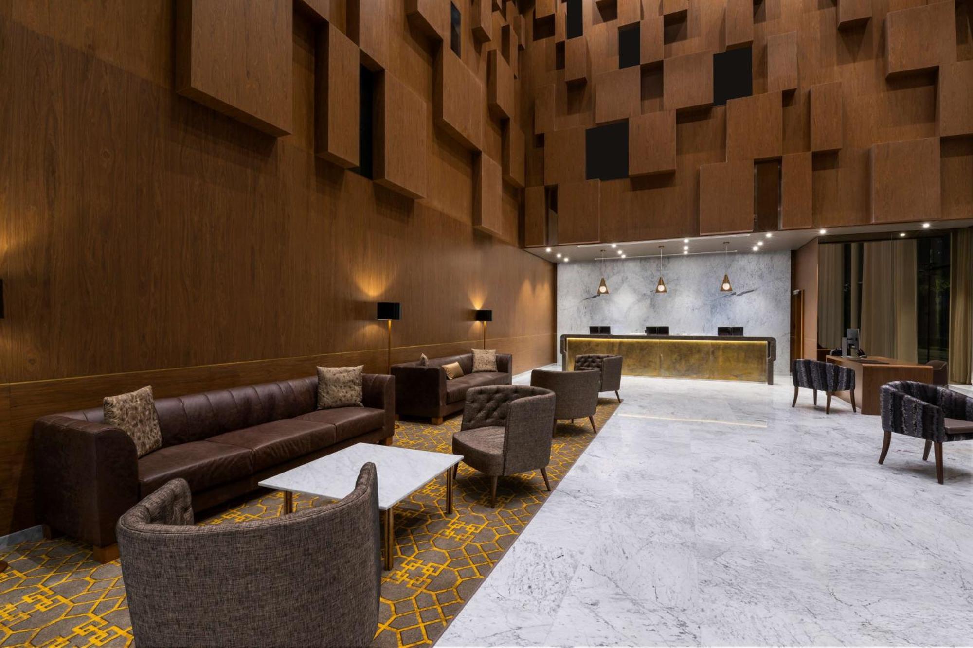 Aleph Doha Residences, Curio Collection By Hilton מראה חיצוני תמונה The lobby of the hotel