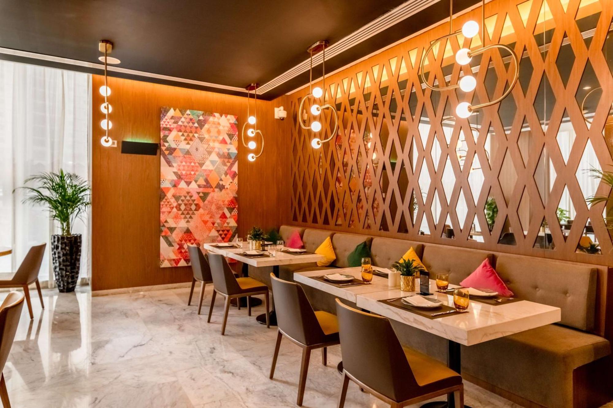 Aleph Doha Residences, Curio Collection By Hilton מראה חיצוני תמונה The interior of the restaurant